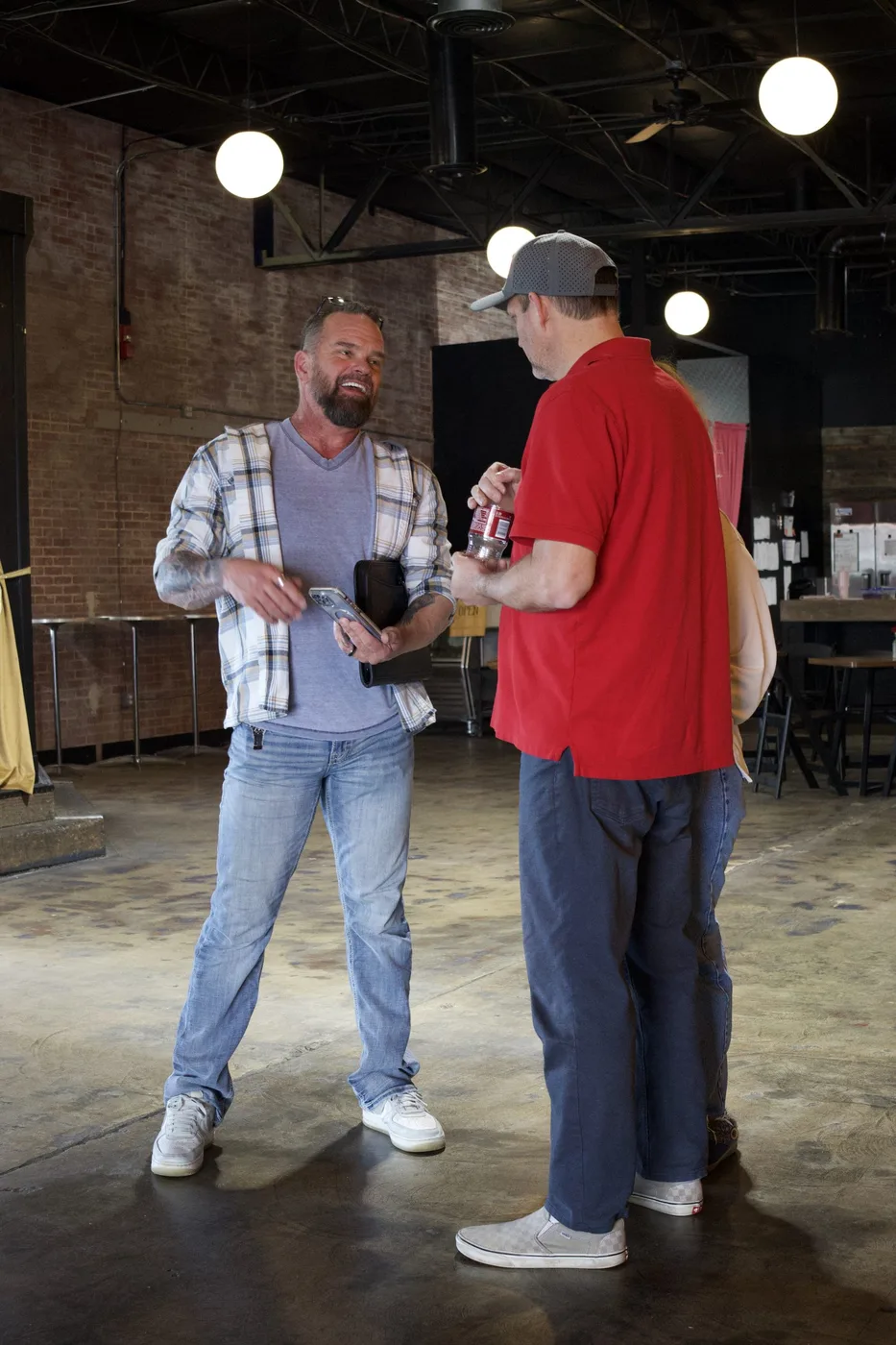 Design for Living Construction team member discussing a project with a client