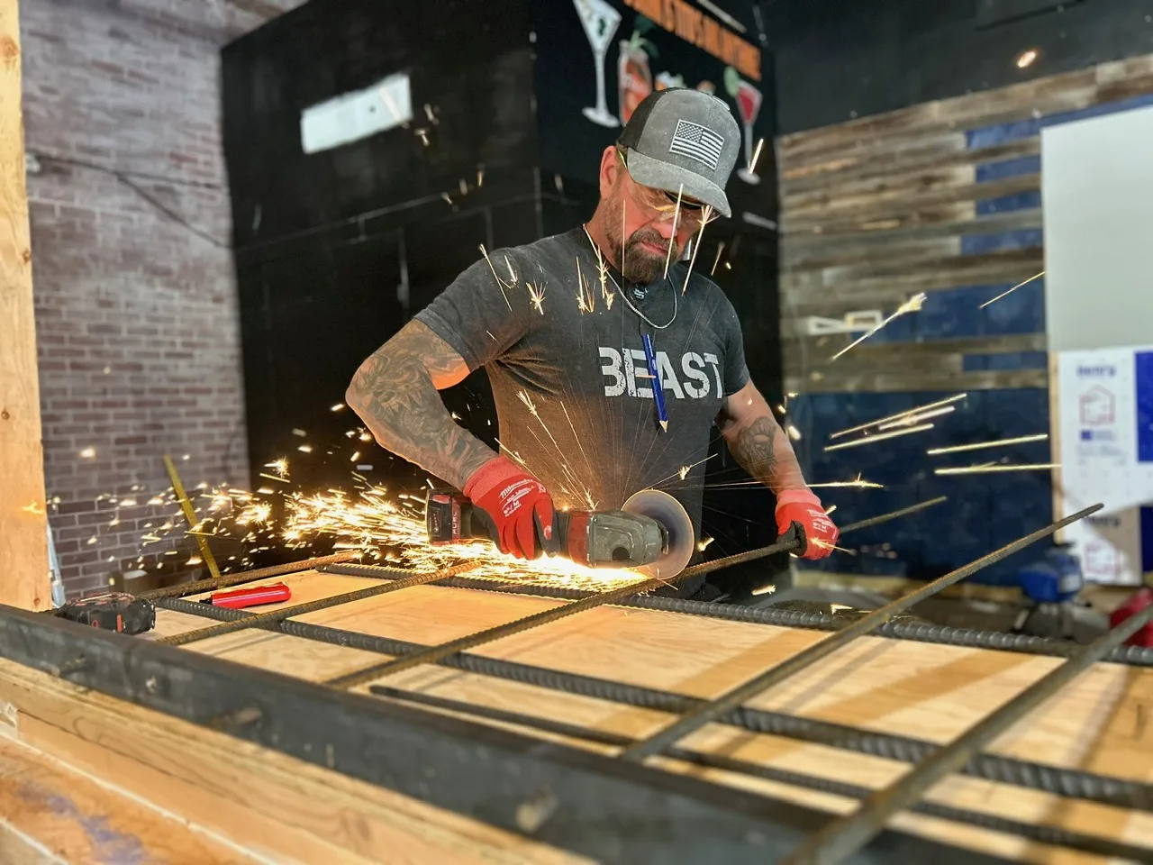 Design for Living Construction crew member cutting rebar for a concrete pour on a Boise project