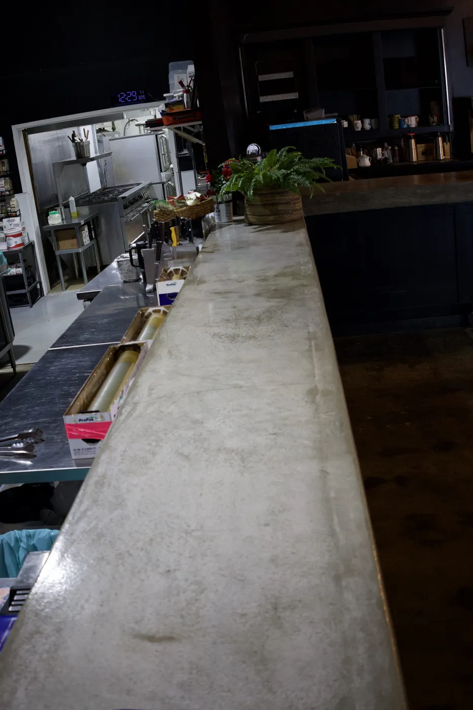 Custom concrete bar and commercial kitchen area built for a Boise event space