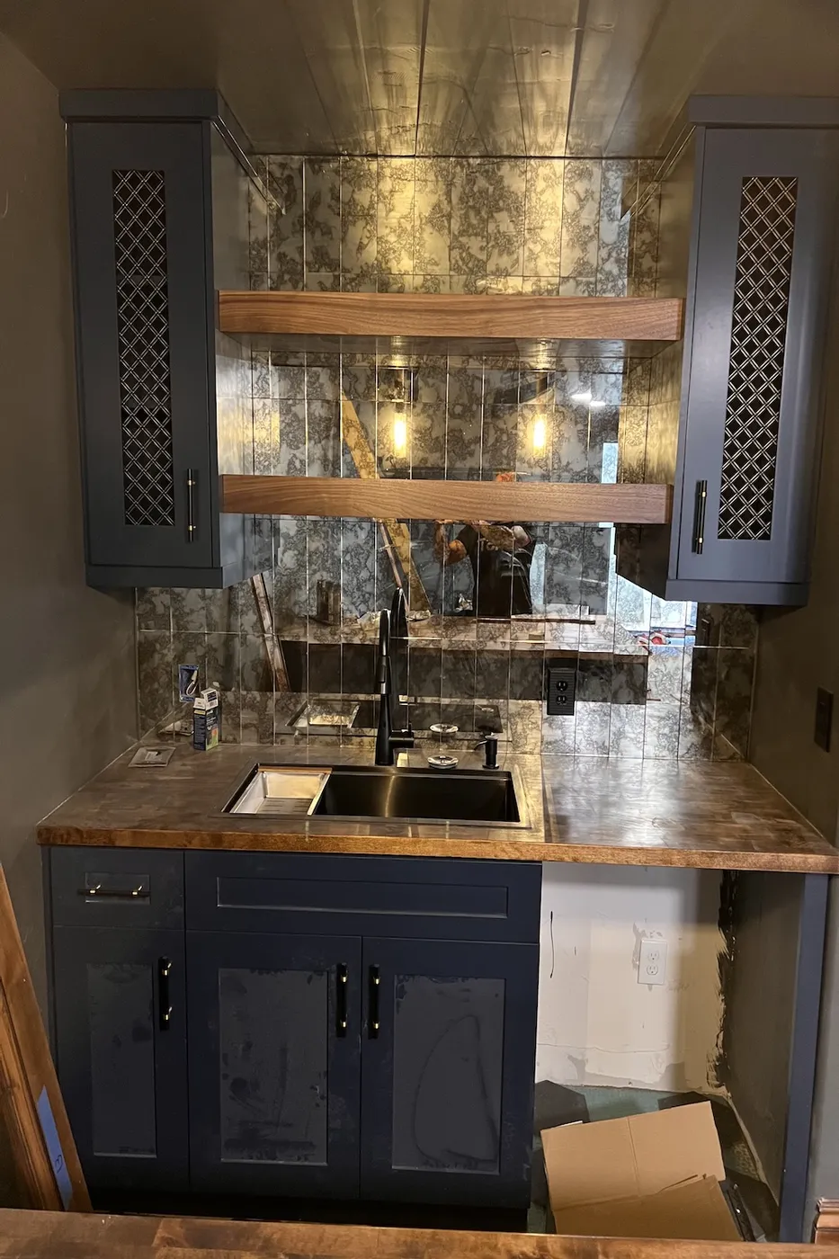Custom basement wet bar with antique mirror backsplash in Boise