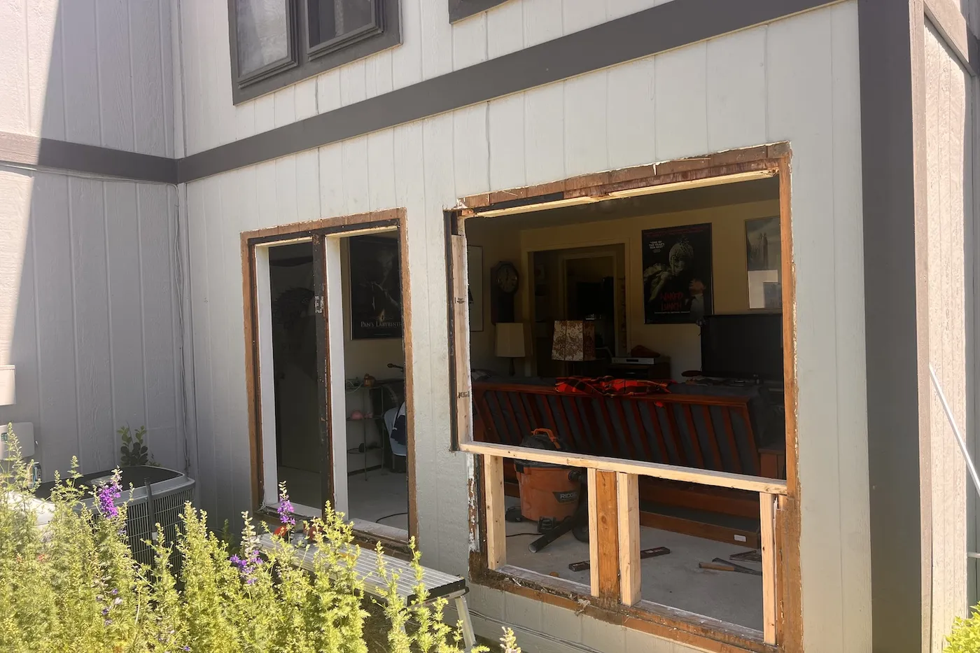 Exterior siding cut open for new window installations during Boise window replacement